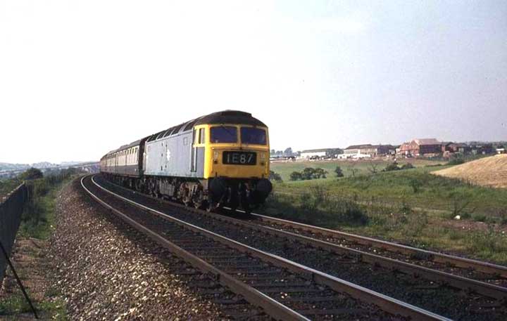 47167 with 1E87 Manchester - Harwich passes Alfreton on 07/06/75, Photo by David Harlott