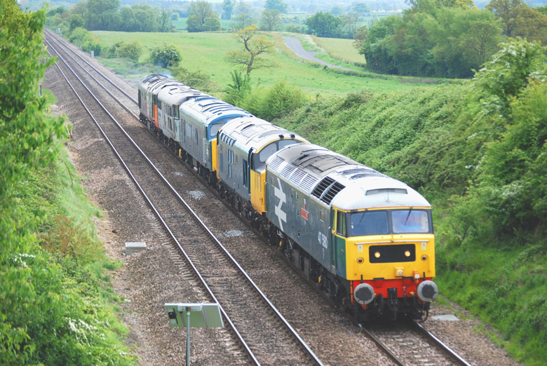 47580 approaches Abbotswood Juntion with 0Z97 08:15 Swanage-Kidderminster with 37254, 45133, 31271 and 50135 on 18/05/10, Photo by Gary Lane