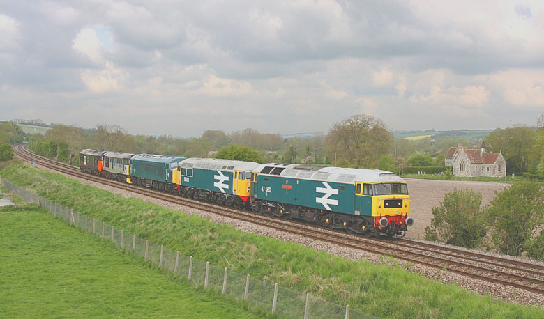 47580 passes LittleL angford in the Wylye Valley with 56101, 45133, 31271, & 50135 with 0Z56 08:30 Kidderminster-Swanage on 05/05/10, Photo by Tom Curtis