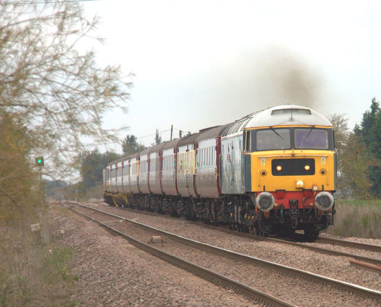 47580 heads across the fens at Black Bank with ECS 5Z78 07:30 Carnforth - Norwich on 15/10/10, Photo by Geoff Tibble