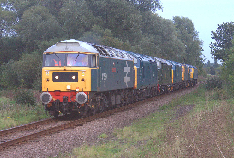 47580 passes through Bournemouth Station with 0Z97 08:15 Swanage-Kidderminster with 37254, 45133, 31271 and 50135 on 22/10/10, Photo by Geoff Tibble