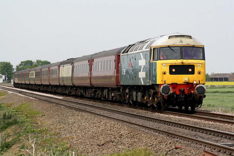 47580 passes Welney Road LC at Manea with 5Z21 06:15 Carnforth - Norwich ECS on 06/05/11, Photo by Paul Johnson