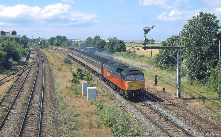 47732 passes Whitacre Jn. with 6F45 Washwood Heath - Corby car train, Date 22/06/02, Photo by John Eyres