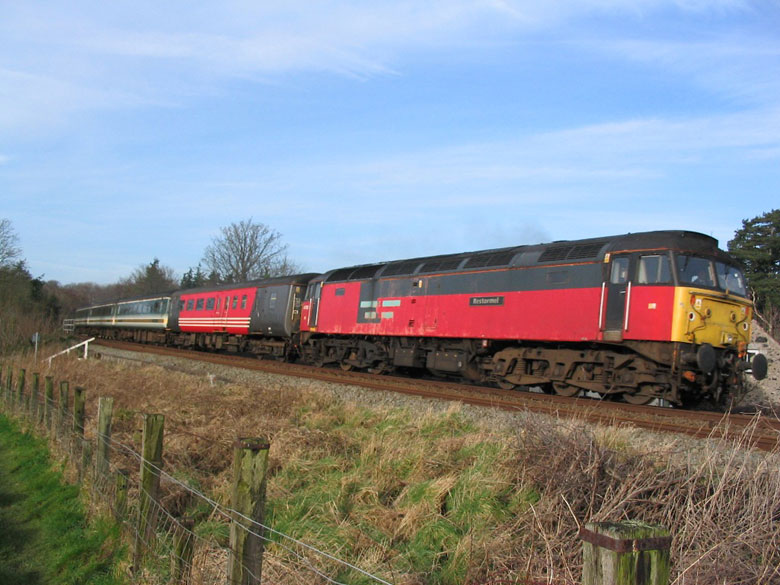 47732 passes Talybont east of Bangor with 1K57 07:45 Holyhead - Crewe on 17/03/04, Photo by Rowan Crawshaw
